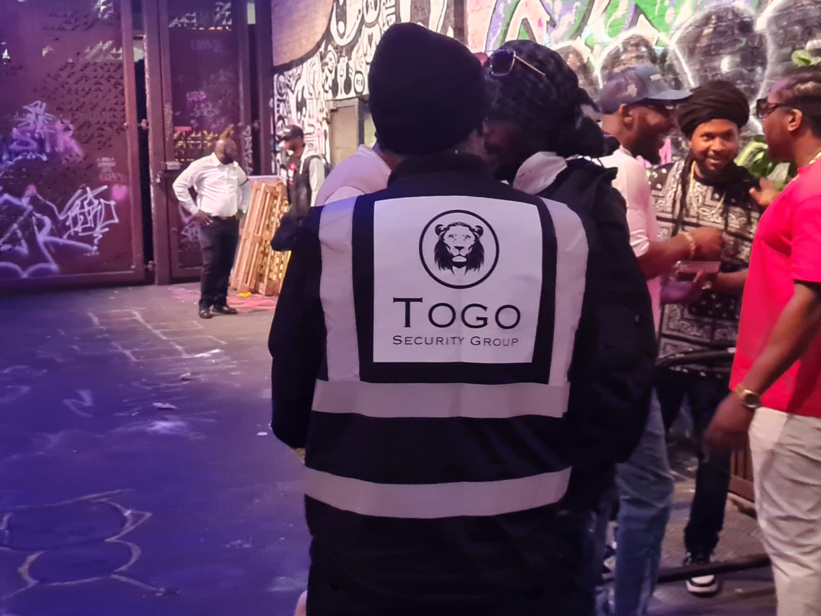 Security operative working inside a busy venue